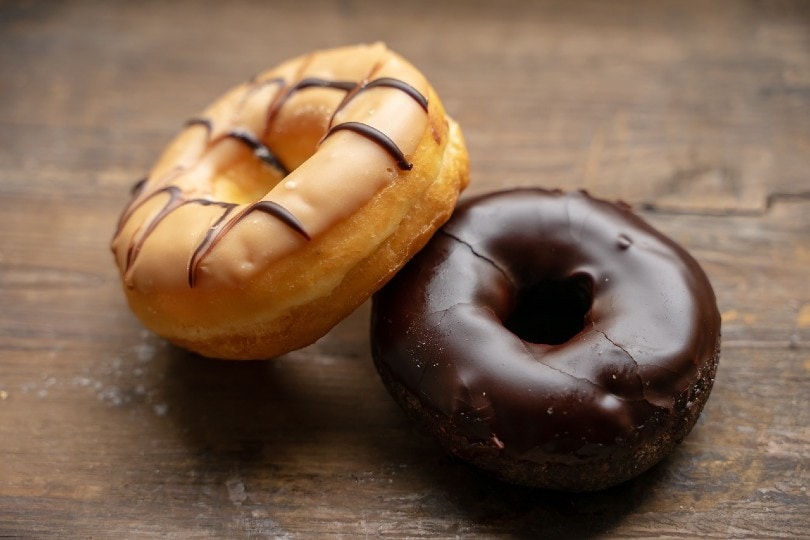 two donuts on wooden table