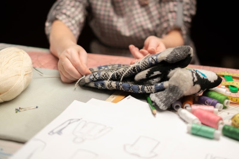 woman holding socks on the table