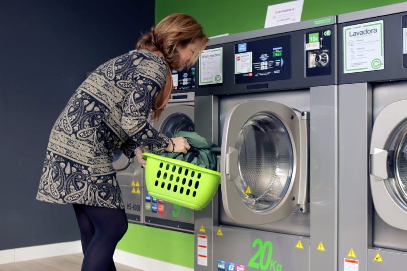 woman using washing machine