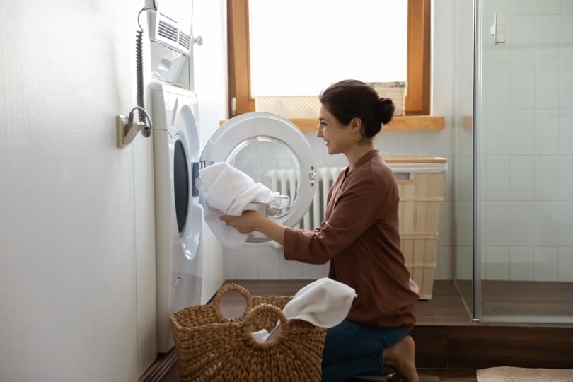 woman using washing machine