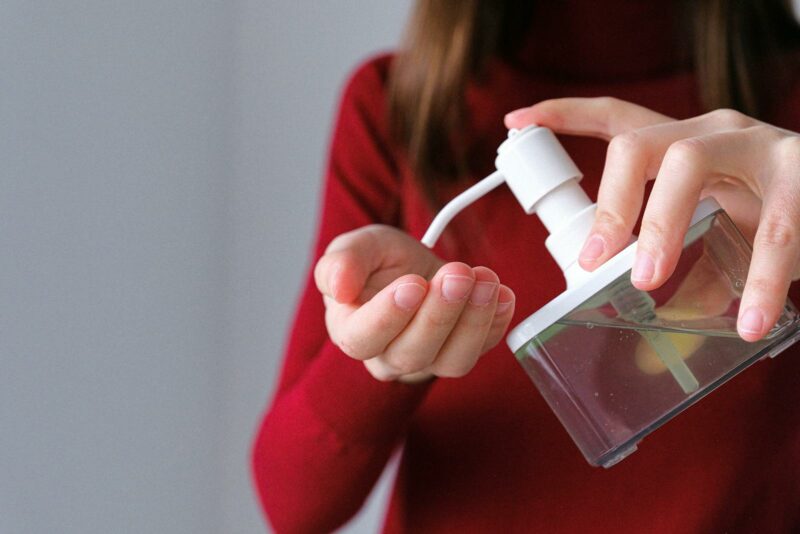 Woman Applying Hand Sanitizer