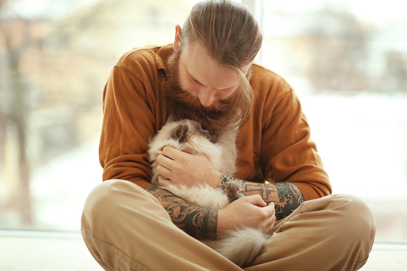 Cat Man Tattoo Sitting Owner