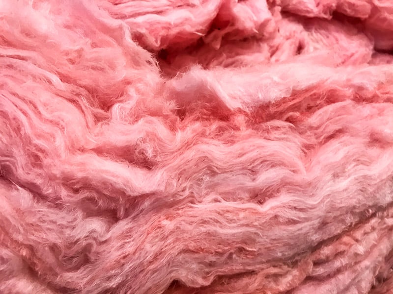 layers of Pink fiberglass insulation
