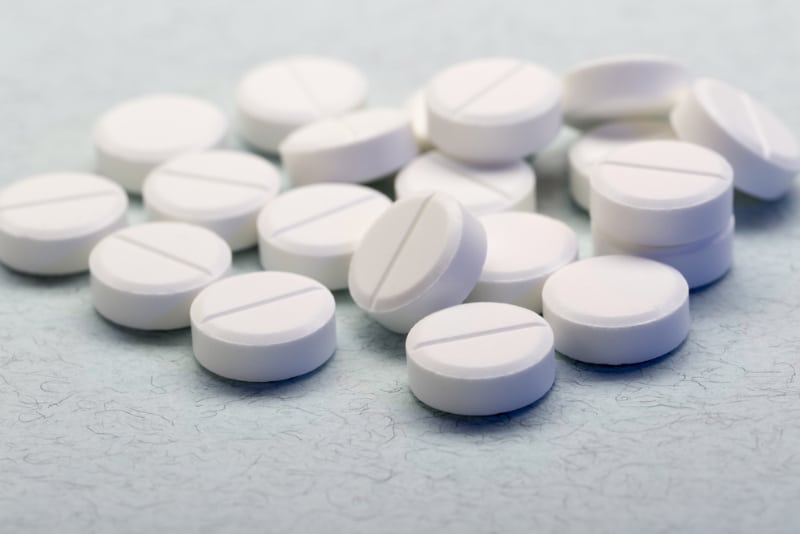 pile of white round tablets