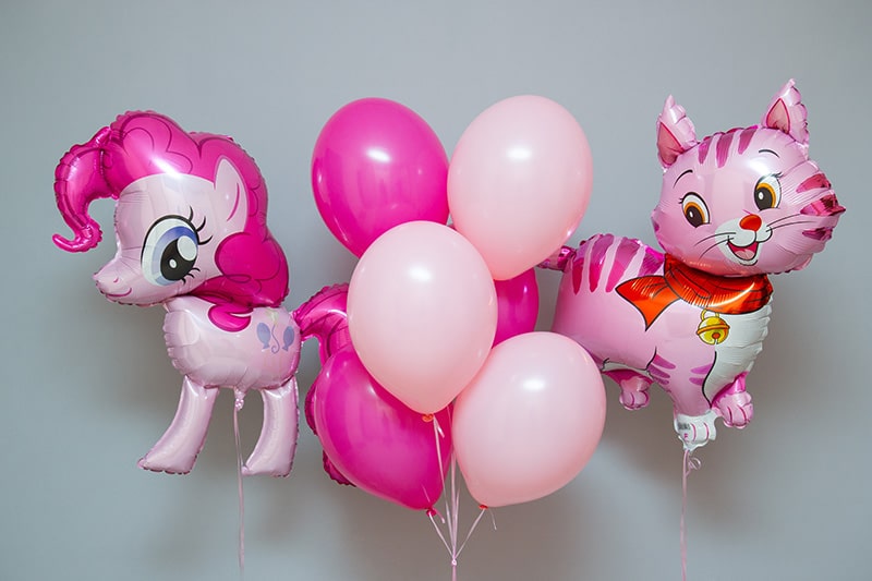 pink party balloons with pony and cat designs