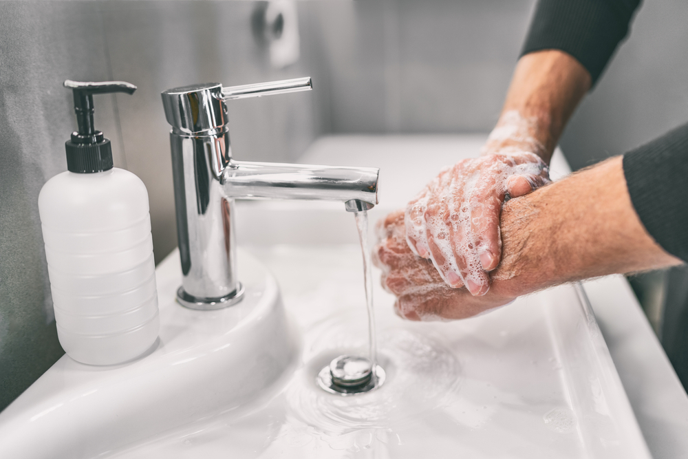 Washing hands rubbing with soap man for corona virus prevention