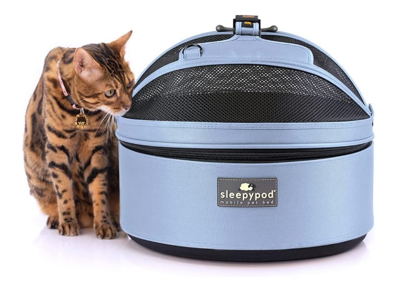 Sleepypod Mobile Pet Bed - cat sitting next to the product