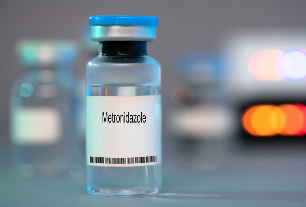 a small glass vial of metronidazole
