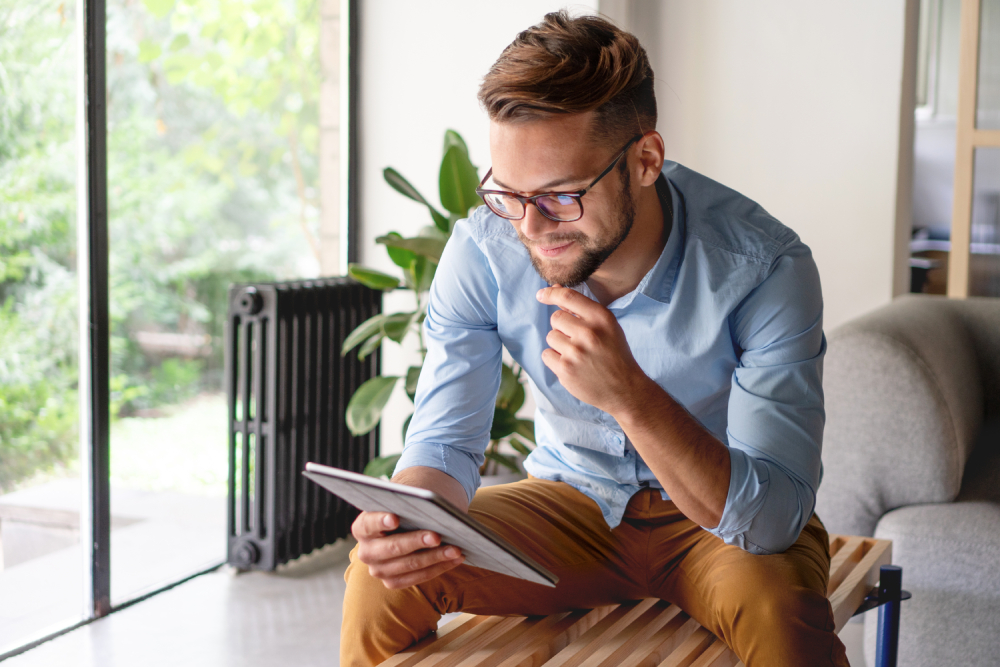 Man looking or reading at the tablet or ipad